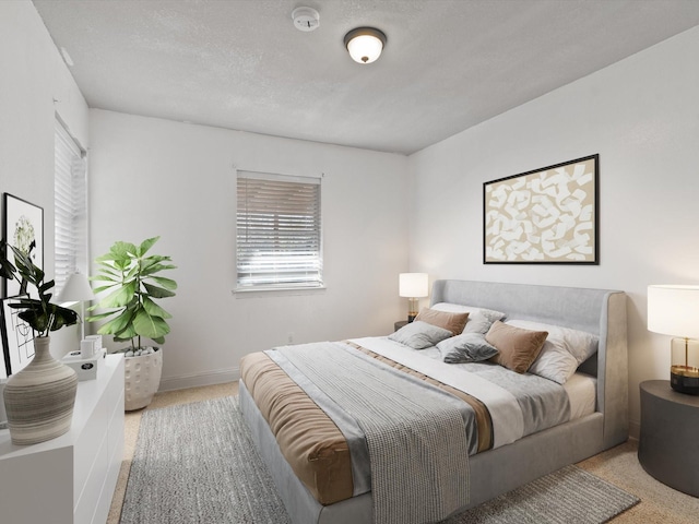 carpeted bedroom with a textured ceiling