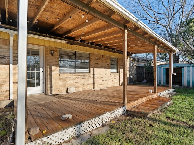 wooden terrace with a shed