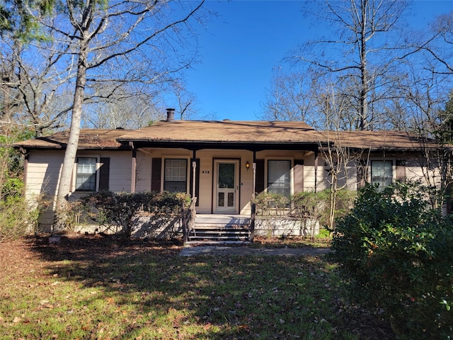 ranch-style house with a front lawn and a porch