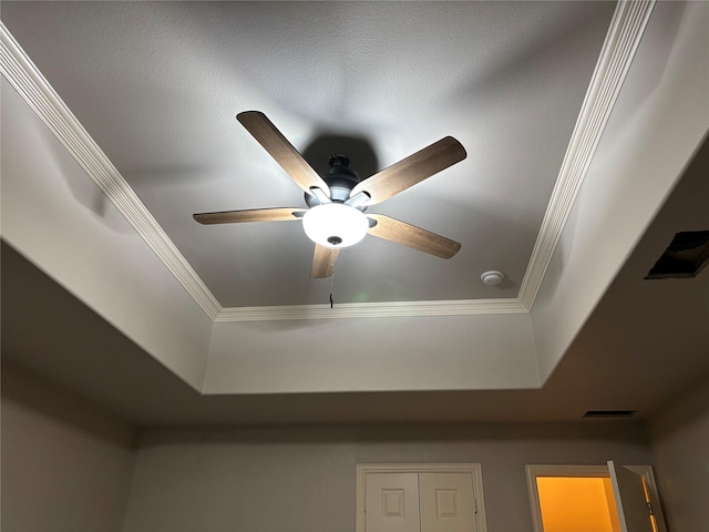 10104 Southpoint Ct, Denton, TX 76207 - detailed view of crown molding, a ceiling fan, a raised ceiling, and a smoke detector