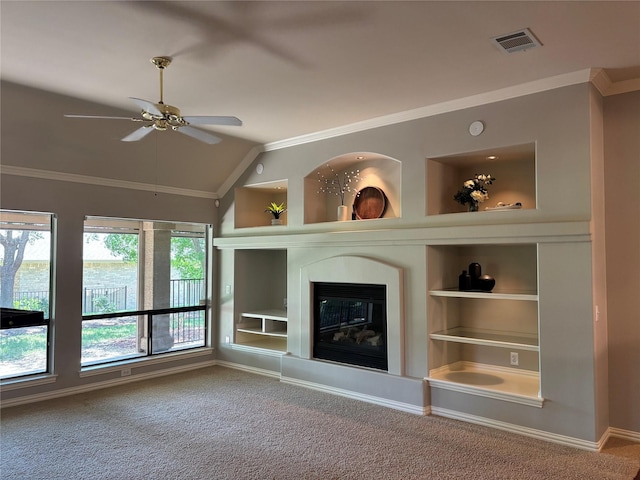 10104 Southpoint Ct, Denton, TX 76207 - unfurnished living room featuring built in features, vaulted ceiling, ornamental molding, a ceiling fan, and carpet flooring