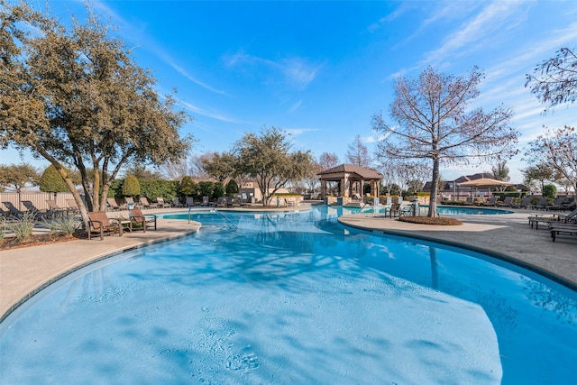 view of swimming pool with a patio area