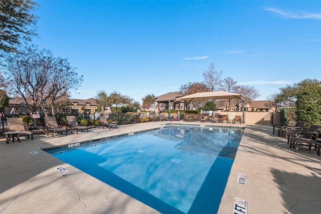 view of swimming pool featuring a patio area