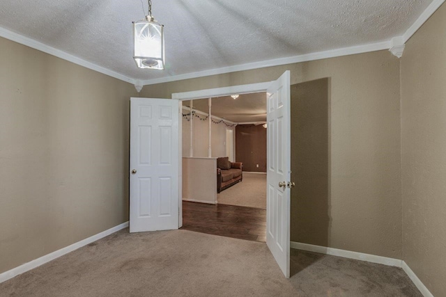 unfurnished room featuring carpet flooring, crown molding, and a textured ceiling