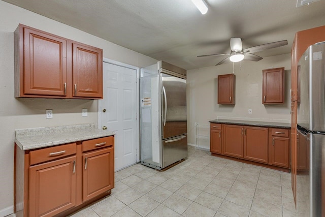 kitchen with ceiling fan and stainless steel fridge