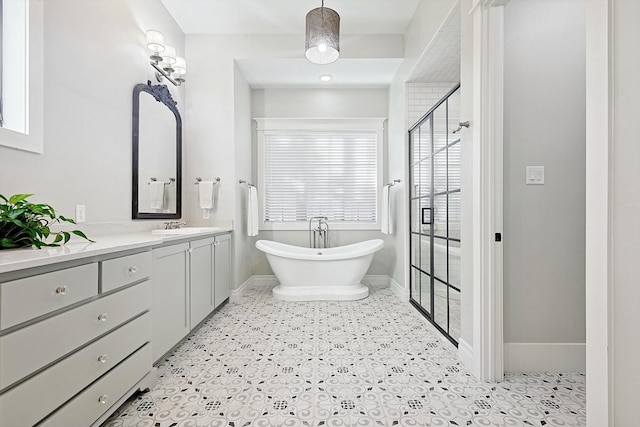 bathroom featuring vanity and separate shower and tub