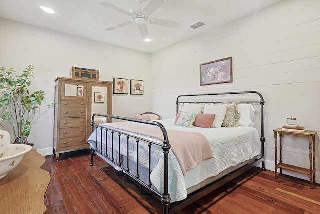 bedroom featuring ceiling fan and dark hardwood / wood-style flooring