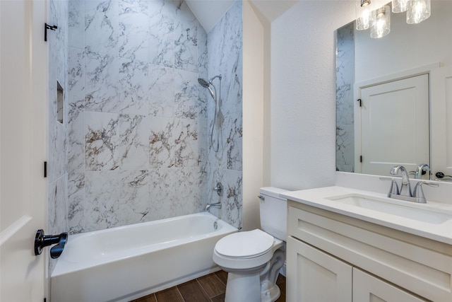 bathroom featuring wood finished floors, vanity, toilet, and shower / bathtub combination