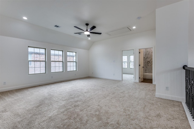 empty room featuring a ceiling fan, a healthy amount of sunlight, visible vents, and light carpet