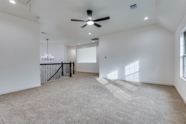 spare room with recessed lighting, light colored carpet, visible vents, baseboards, and attic access