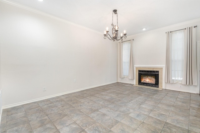 unfurnished living room featuring ornamental molding, plenty of natural light, and a chandelier