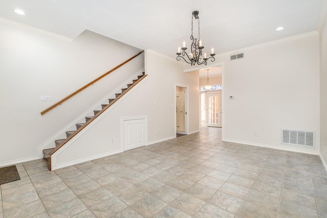 unfurnished room featuring ornamental molding and a chandelier