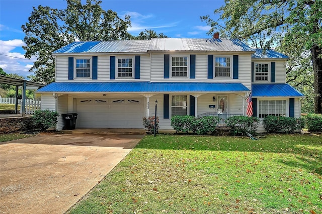 view of front of house with covered porch, a garage, and a front lawn