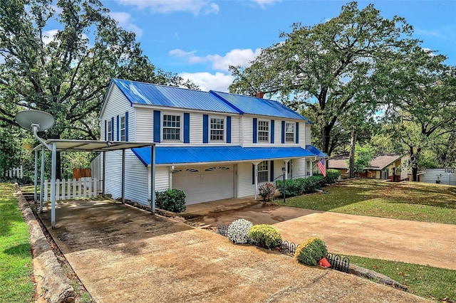 view of front facade with a garage and a front lawn