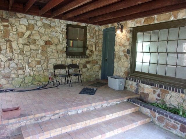 entrance to property with a patio