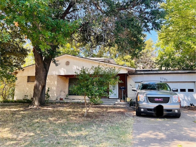 view of front of house featuring brick siding and an attached garage