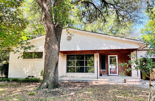 1721 Cooper Dr, Irving, TX 75061 - view of front of property featuring a porch and brick siding