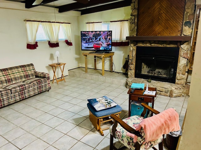 living area featuring tile patterned flooring, a stone fireplace, and beamed ceiling