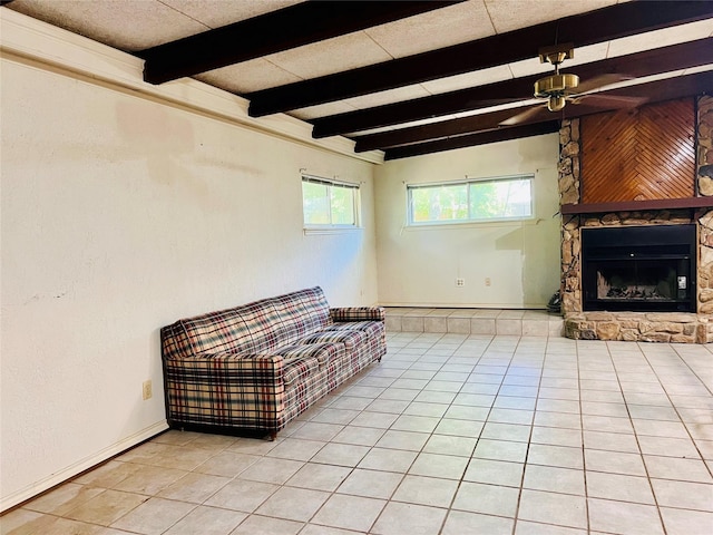 1721 Cooper Dr, Irving, TX 75061 - sitting room featuring a ceiling fan, light tile patterned floors, and beam ceiling
