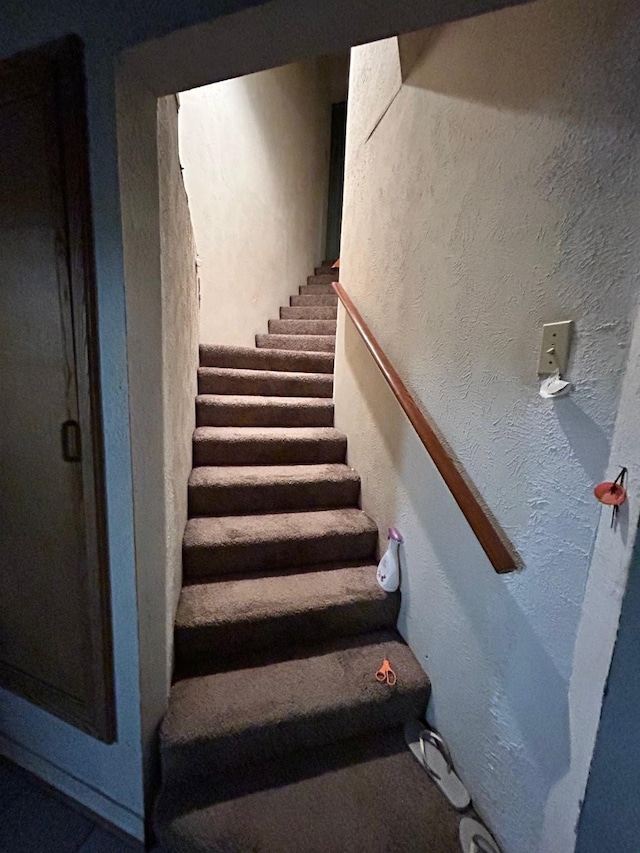 1721 Cooper Dr, Irving, TX 75061 - staircase featuring a textured wall
