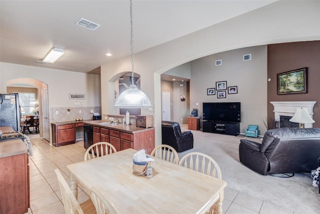 tiled dining space featuring sink