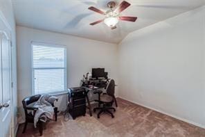 office space featuring carpet flooring, plenty of natural light, and lofted ceiling