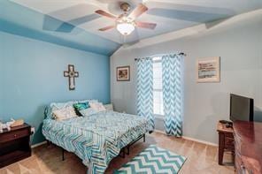 bedroom featuring ceiling fan and lofted ceiling