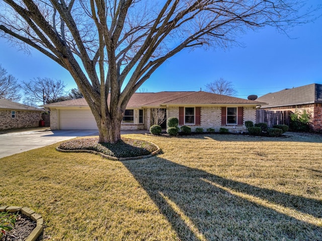 ranch-style house with a garage and a front lawn