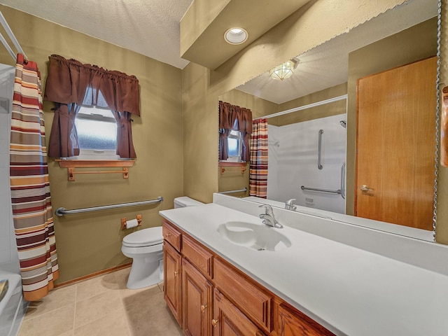 bathroom with vanity, toilet, and a textured ceiling