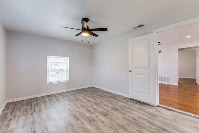 spare room with ceiling fan and light hardwood / wood-style floors