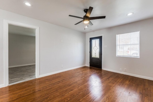 entryway with ceiling fan and dark hardwood / wood-style flooring