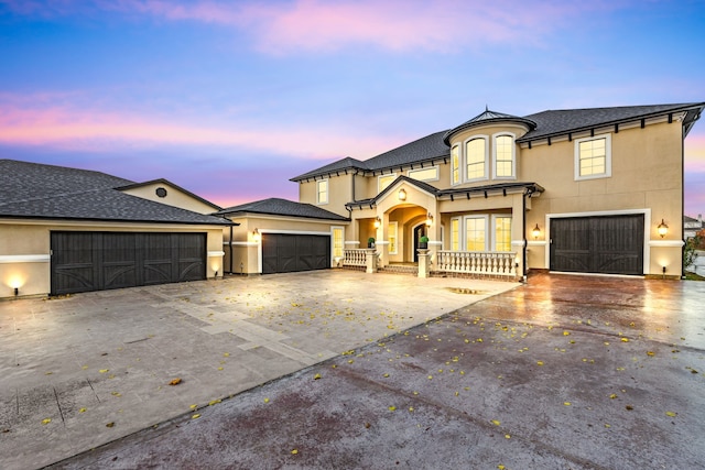 view of front of home with a porch and a garage