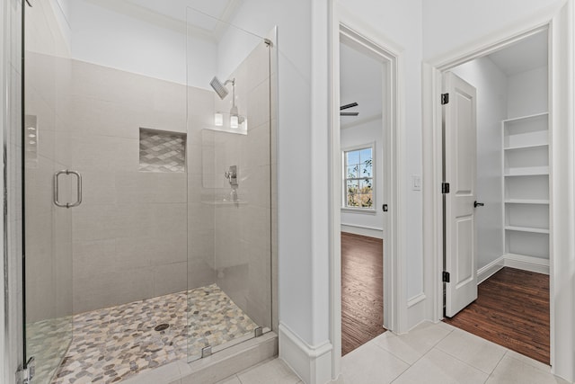 bathroom featuring tile patterned flooring and a shower with door