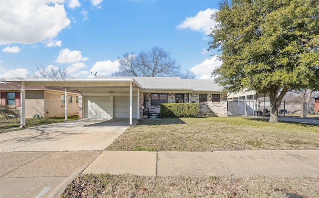 ranch-style home with a front yard and a garage