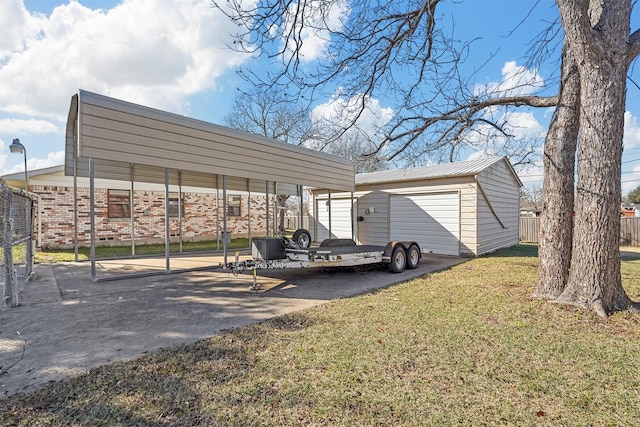 view of parking / parking lot featuring a lawn and a carport