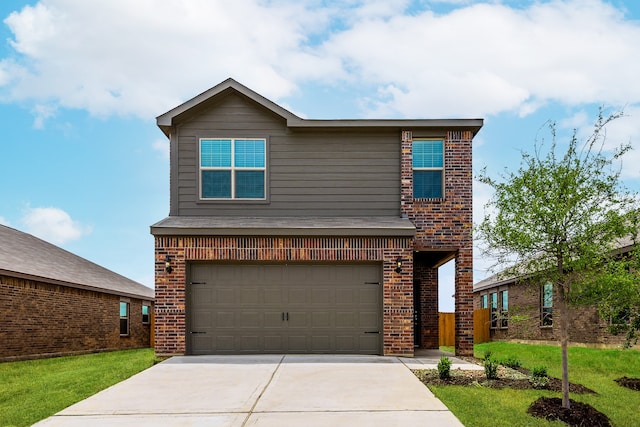 view of front of property with a garage and a front lawn