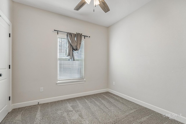 carpeted empty room featuring ceiling fan