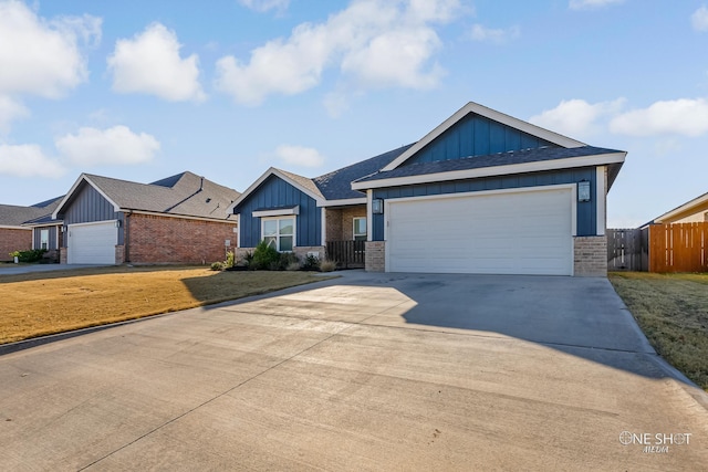 view of front of house featuring a garage and a front yard