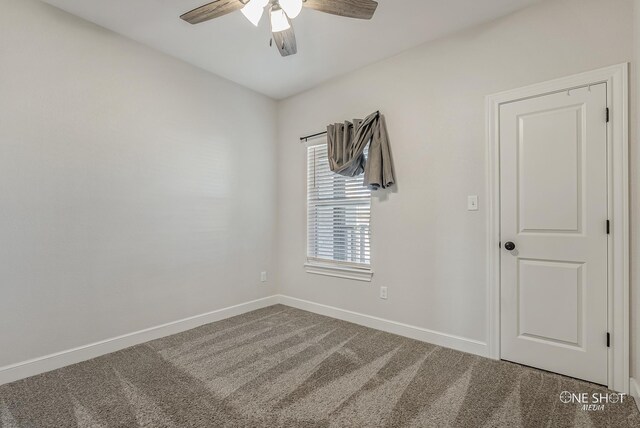 carpeted empty room with ceiling fan