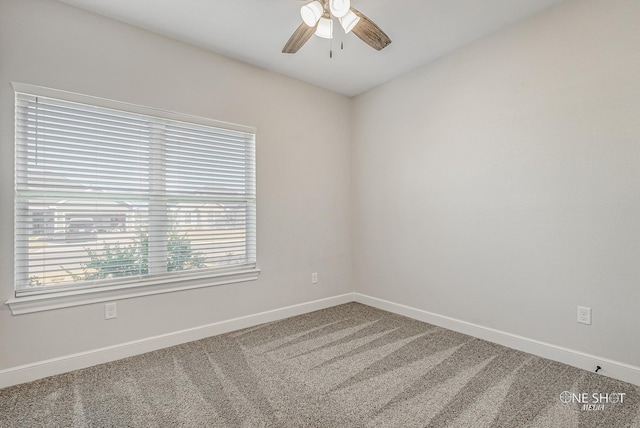 empty room featuring carpet flooring and ceiling fan