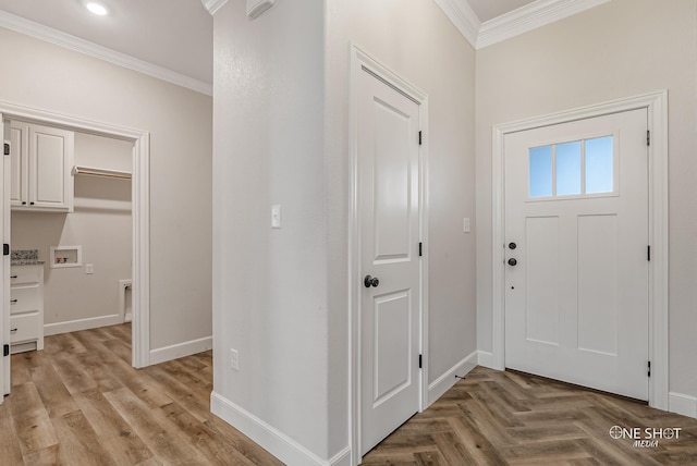 foyer entrance featuring crown molding and light parquet flooring