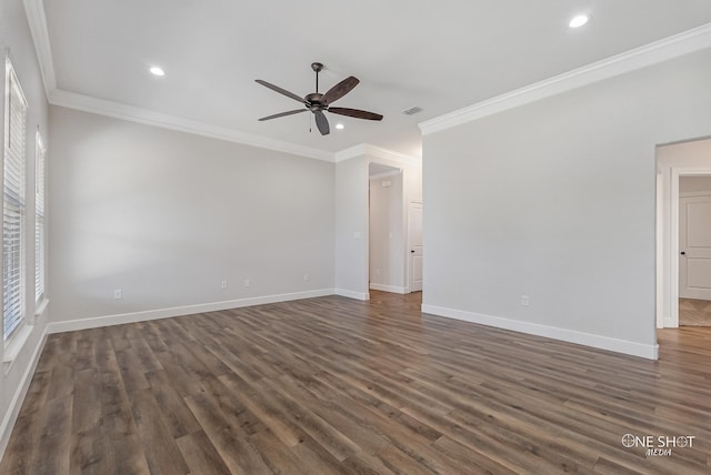 spare room with crown molding, ceiling fan, and dark hardwood / wood-style flooring