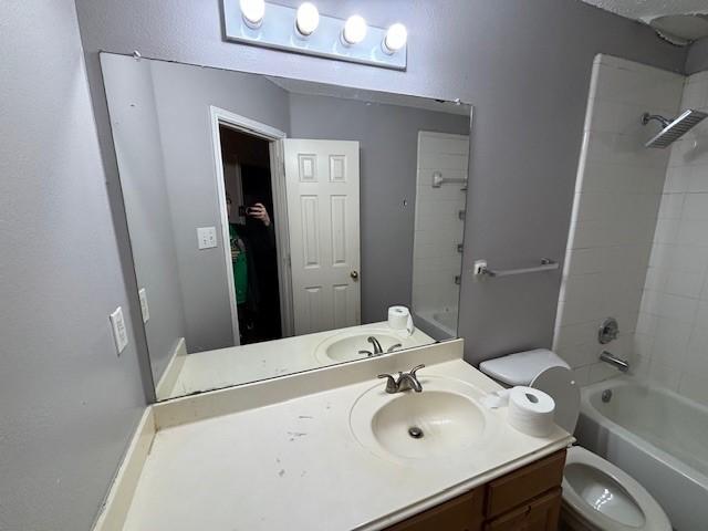 full bathroom with vanity, shower / bathing tub combination, and toilet