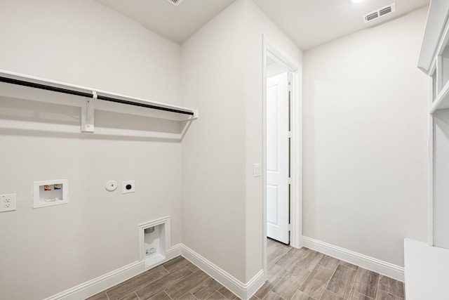 washroom featuring hookup for a gas dryer, hookup for a washing machine, and electric dryer hookup