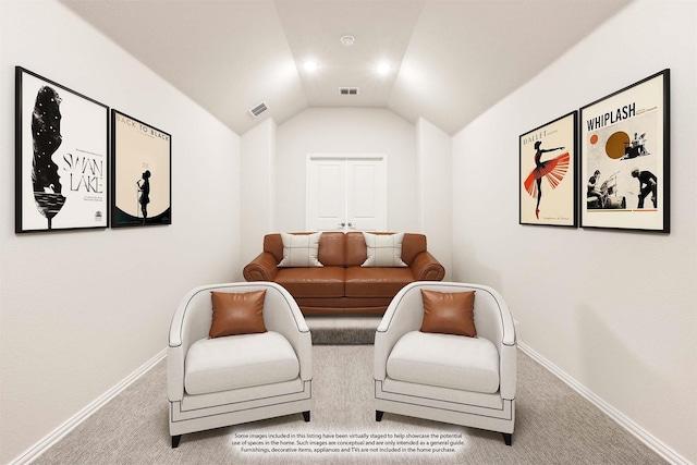 sitting room featuring lofted ceiling and carpet floors