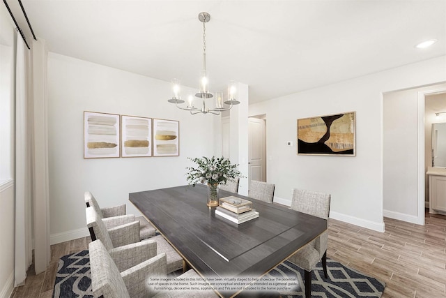 dining room with an inviting chandelier and light wood-type flooring