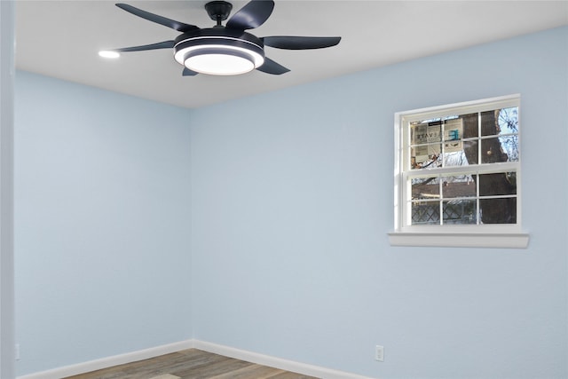 unfurnished room featuring ceiling fan and wood-type flooring