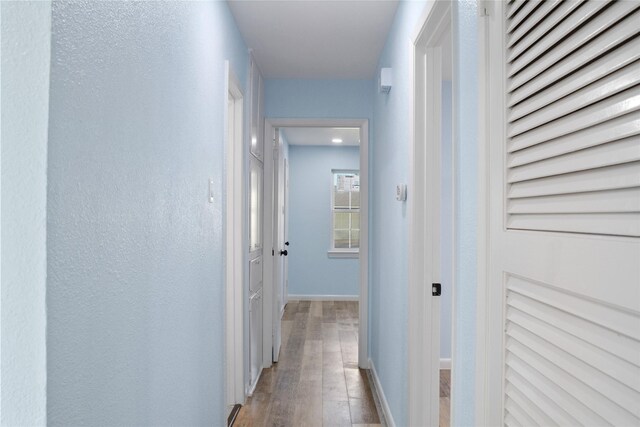 hallway featuring light hardwood / wood-style flooring