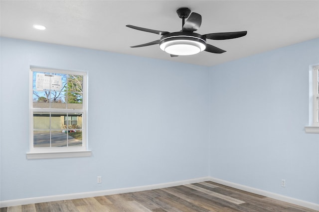 spare room with wood-type flooring and ceiling fan