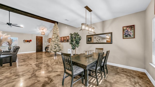 dining room with ceiling fan and concrete flooring